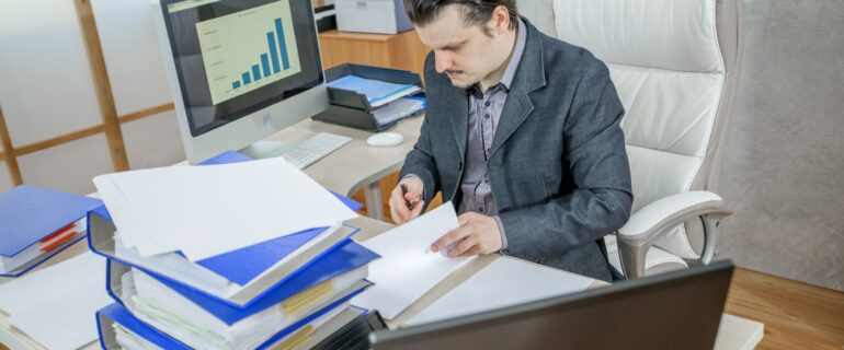 A young businessman working from his office - the concept of hard work
